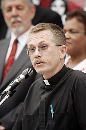 The Rev. Larry Clark calls on churches to assist a petition drive for an amendment to boost Ohio's minimum wage.