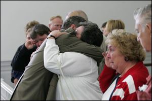 Chief Assistant Prosecutor Paul Dobson hugs Joyce Baird, mother of murder victim Deana Meeks, after the conviction yesterday of Ralph Doren in Ms. Meeks  1991 slaying.
