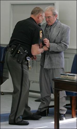 A deputy handcuffs Ralph Doren after his conviction in Wood County court for the 1991 slaying of Deana Meeks.