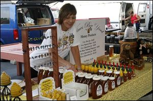 Debbie Wines of Wines Bee Yard sells her products at the Toledo Farmers' Market.