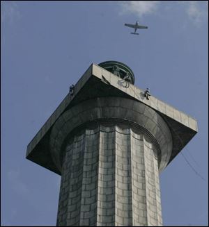 Engineers examine the observation deck of Perry's Victory & International Peace Memorial. 