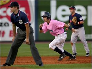 Mud Hen catcher Mike Rabelo rounds second base after hitting a double that plated Jack Hannahan, Ryan Raburn and Ryan Ludwick at Fifth Third Field last night. 