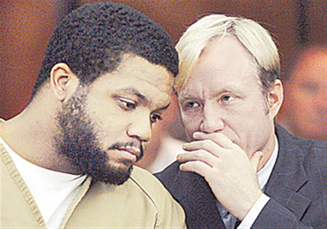 Former-Ohio-State-football-star-Maurice-Clarett-talks-with-attorney-Nick-Mango-before-pleading-guilty-to-aggravated-robbery-and-carrying-a-concealed-weapon-in-Columbus-Ohio.jpg