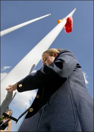 Ju Leigh Serpa of Notre Dame Academy raises Spain's flag  to mark the 75th year of the Sister City relationship.