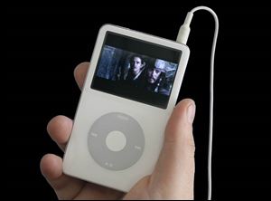 Pirates of the Caribbean: The Curse of the Black Pearl plays on a video iPod.
