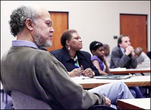 Abdul Alkalimat, left, participates in a meeting at the Student Union on the future of Africana studies at UT. 