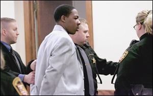 Christopher Mason is led from Common Pleas Court after a jury found him guilty of murder.