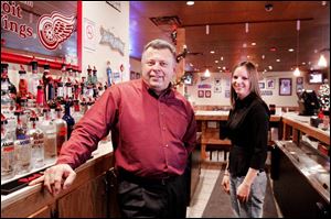 Owner Mark Clark and bartender Shannon Russell have seen business fall off at Andy's Bar and Grill since the smoking ban.