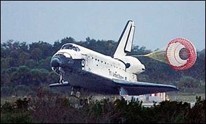 The space shuttle Discovery lands at the Kennedy Space Center in Cape Canaveral, Fla., this afternoon.