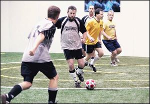 Mark Hardy of Toledo competes in a soccer league for men over 40 at Gold Medal Indoor Sports in Rossford. 