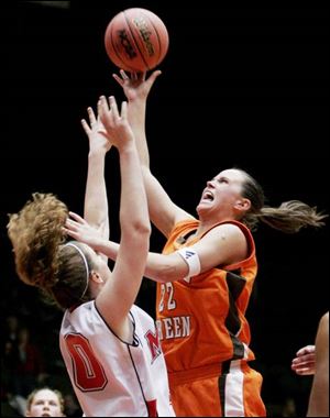 The Falcons' Ali Mann puts up a shot over Miami's Stephanie Ford. Mann led Bowling Green with 18 points.