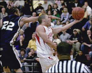 Central s Matt Collins gets inside St. John s Michael Taylor for two points. Taylor scored 15 points for the Titans.
