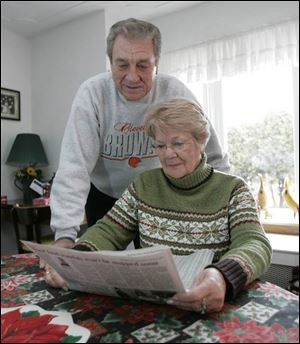 Thomas and Donna Hafner, looking over The Blade's stock listings in their Point Place home, said their contest picks are made up largely of stocks they have owned, including General Motors and Sun Microsystems.