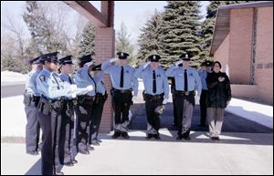 The Toledo Police Department honor guard practices for the funeral of Toledo police Detective Keith Dressel.