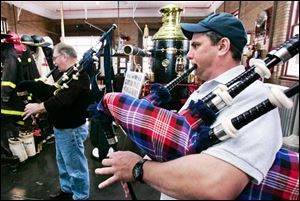 Bagpiper Don Newman, left, will give a solo rendition of  Going Home  inside the church. At right is bagpiper Steve Romstadt.