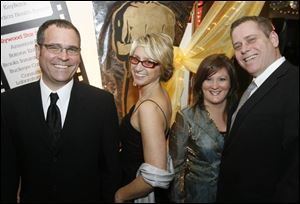 Steve and Michelle Atkinson, left, with Anne and Brian Schenk at Owens Community College for the Academy Awards party.