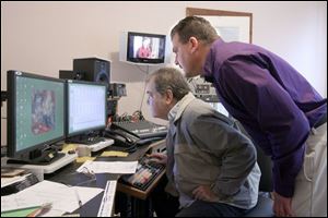 Ronald Hanson and James Dickman examine call statistics from commercials the company airs.
The Midwest Center ads generate about 26,000 calls a week.