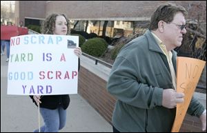 Sarah Nash, and other Monroe residents express their opposition to the scrap yard proposed for their city. Monroe council voted last week to rezone a site to accommodate such a facility.