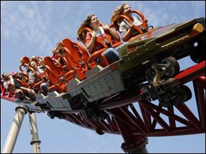 Blade reporter Erika Ray, front left, conducts one of her multiple 'research' rides aboard Maverick during the media visit. 