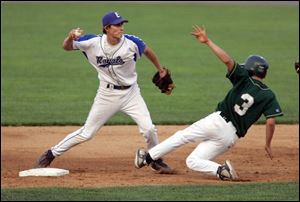 Elmwood shortstop Cory Stewart tries to turn a double play. Good defense played a major role in the Royals' victory.