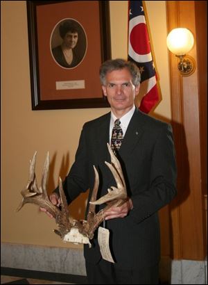 This set of antlers from a poaching case, held by Rep. Bob Latta, would cost a convicted poacher $15,850 under the proposal.