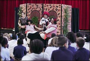 Leslie Hochman, left, Angelo Marchese, Leandra Ramm, and Timothy Hill of Opera on Wheels perform for students at Walbridge Elementary School.