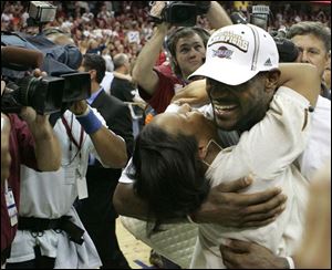 LeBron James hugs girlfriend Savannah Brinson after the Cavaliers defeated the Pistons for the Eastern Conference title.