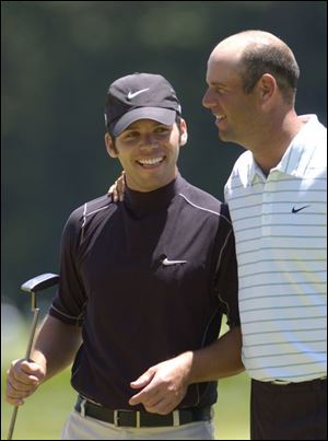 Paul Casey, left, and Stewart Cink enjoy a moment on the eighth hole yesterday. Casey shot a 4-under 66 while the field averaged 76.933 in the second round of the U.S. Open.