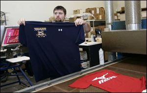 Team Sports Inc. of Holland has been used by the University of
Toledo to make T-shirts. Vanderbilt University tried to pay the company $6,000 for a game Vanderbilt played with UT.