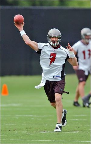 Jeff Garcia tosses a pass during a Tampa Bay workout. The 37-year-old quarterback led the Eagles to the playoffs last season.