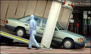 This Mercedes is taken away from The Haymarket in the Piccadilly area of central London which is cordoned off as police officers investigate.