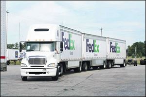 A triple-trailer rig exits the FedEx transfer area on its way to
Chicago. Toledo is trying to retain the carrier and its jobs.