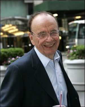 Rupert Murdoch arrives at the News Corp. building in New York today.