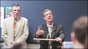 Earl Reid, left, Lucas County director of facilities, and Judge James Jensen review the state of the courthouse.