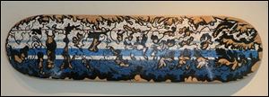 One of seven skateboard decks by Jared  MEDE  Oberle on display on the fourth fl oor of Space 237 in downtown Toledo.
