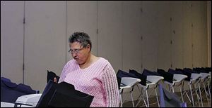 JoAnn Valvo is the lone voter as she casts a ballot today in precinct 24G at Genesis Dreamplex.