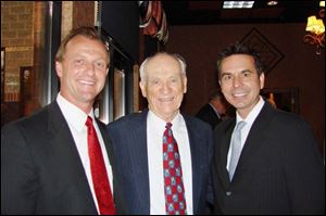 Ron Jurgenson, left, Ernie Harwell, and John Mangus chat during the United Way s Community Building
event.