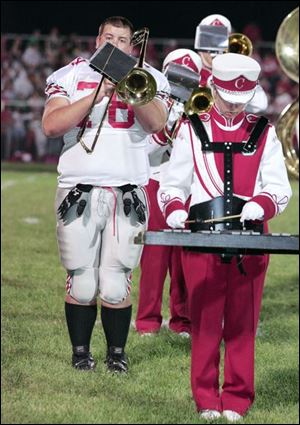 Central's Bill Gergich spends his half-time on the field with the band, during Anthony Wayne vs. Central game at AW.