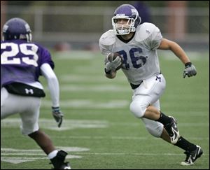 Mount Union's Nate Kmic, a Delta High School graduate, faces a teammate during practice this week in Alliance, Ohio.