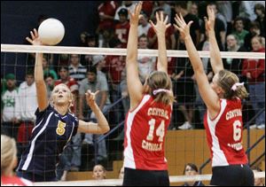 Notre Dame s Paige Roback hits the ball against Central Catholic s Julia Haupricht. The sophomore leads the team with 187 kills. The Eagles are 21-3 and will play Saturday against St. Ursula in the Division I district final.