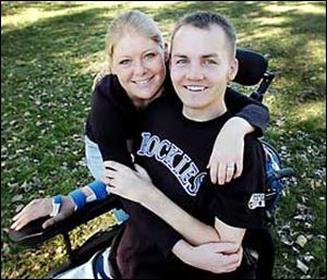 Matthew Keil, with his wife Tracy, at their home in Parker, Colorado. The Anthony Wayne grad will participate in World Series ceremonies on Saturday.