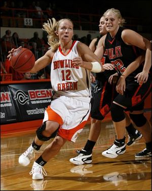 Bowling Green guard Whitney Taylor has a step on Findlay
defenders as she drives to the basket. She scored 17 points.