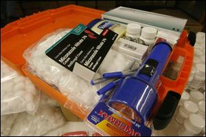 The caregiver kits contain a flashlight, latex gloves, a notebook, and more.