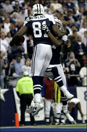 Receiver Terrell Owens celebrates his second quarter TD against Green Bay Thursday night.