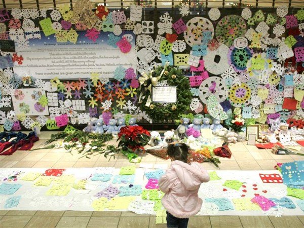 Funeral homes full, candles lit for those killed in mall shooting