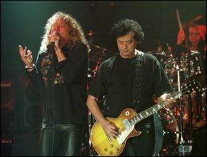  Led Zeppelin's Robert Plant, left, performs with guitarist Jimmy Page during their concert in Istanbul in this March 5, 1998, file photo.