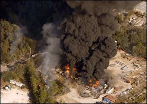 Flames and smoke rise from the site of T2 Laboratories in Florida.