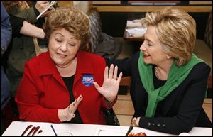 Democratic presidential hopeful, Sen. Hillary Rodham Clinton, D-N.Y., talks with Marilyn Spina while having lunch with supporters at Tursi's Latin King restaurant on Thursday in Des Moines, Iowa.