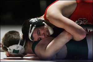 Oak Harbor senior Keith Witt holds down Medina Highland s Alec Phillips in a 171-pound match. Witt is 30-4 and finished fifth at state last year. He will wrestle at Kent State. (THE BLADE/JEREMY WADSWORTH)
<br>
<b>BCSN VIDEO</b>
<br>
<img src=http://www.toledoblade.com/graphics/icons/video.gif> VIEW: <a href=