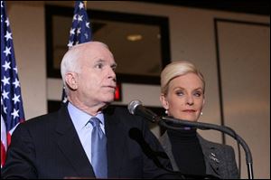 John McCain, with his wife, Cindy, by his side, stood at a podium at the Park Inn on Summit Street in Toledo yesterday to comment on a New York Times story. (THE BLADE/AMY E. VOIGT)
<br>
<img src=http://www.toledoblade.com/graphics/icons/photo.gif> <b><font color=red>VIEW</b></font color=red>: <a href=